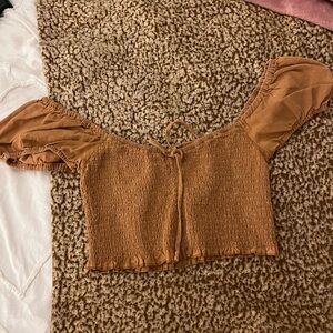 Crop burnt orange top